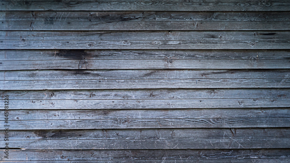 Dark grey rich wooden background from horizontal planks