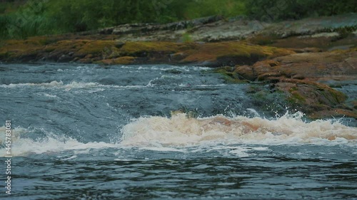 River threshold on a small forest river. Close-up Super slow-motion shooting of the rapid river threshold.