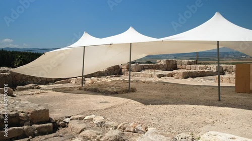 Megido Canaanite and Israelite. High quality photo from Israel. white parasols in the archaeological site. UHD video photo