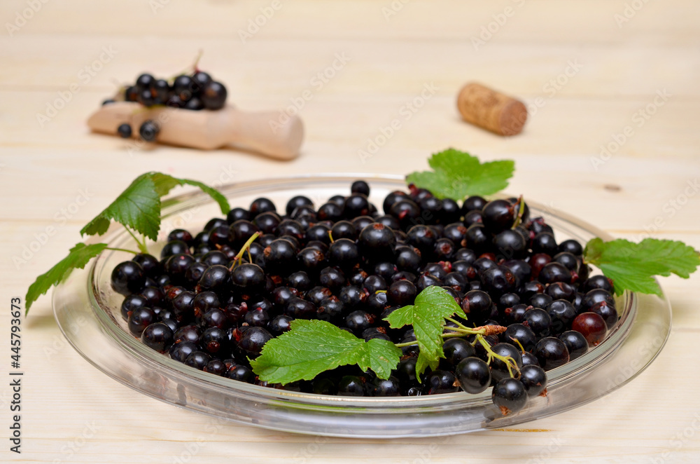 dish with black currants on the table close-up dish with black currants on the table close-up