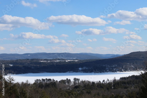 Stockbridge Bowl, also known as Lake Mahkeenac, in Massachusetts in winter with snow on the ground seen from a viewpoint known as 