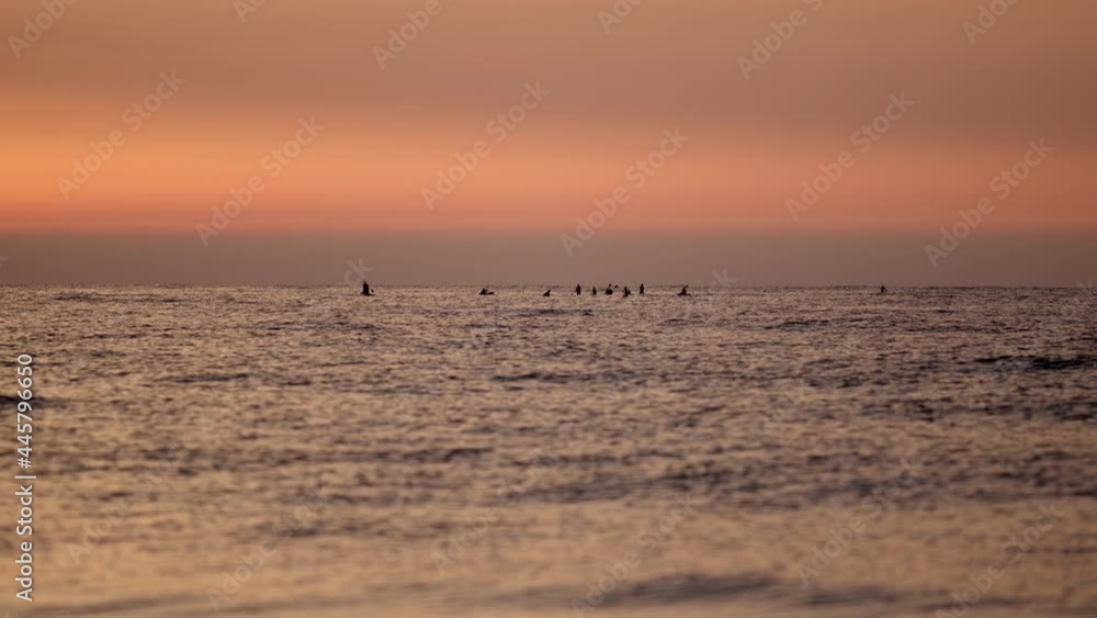 Drone flight over sea, group of surfers welcome the sunrise on the sunrise golden hour. 4k Drone flight over sea, group of surfers welcome the sunrise on the sunrise golden hour. 4k