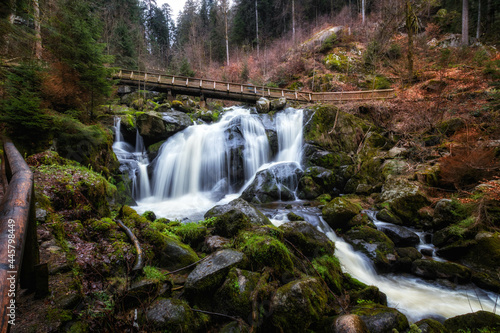 Beautiful shot of a waterfall surrounded by greenery in Germany photo