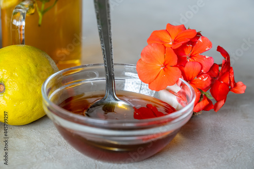 Natural honey with roses and citruses photo