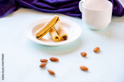 Arabic sweets. Traditional eid semolina maamoul or mamoul cookies with dates and  walnuts photo