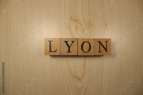 The word Lyon was created from wooden letter cubes. Cities and words. photo