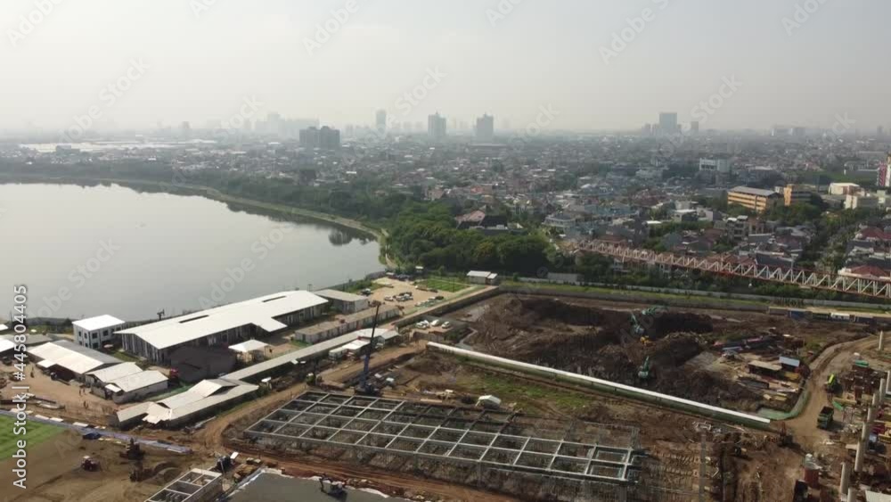 Aerial view of a construction
the stadium is close to the highway and residential areas Aerial view of a construction
the stadium is close to the highway and residential areas