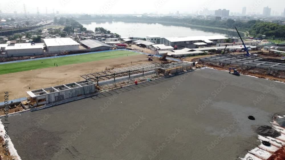 Aerial view of a construction
the stadium is close to the highway and residential areas Aerial view of a construction
the stadium is close to the highway and residential areas