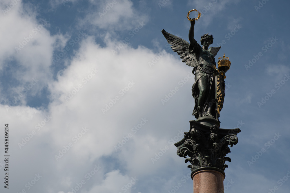 Fototapeta premium Statue of Victory, designed by Johann Rößner, on top of the Kriegerdenkmal Köpfleinsberg in Nuremberg, Germany, a 19th-century victory column memorial for the fallen of the 1870/71 Franco-Prussian War