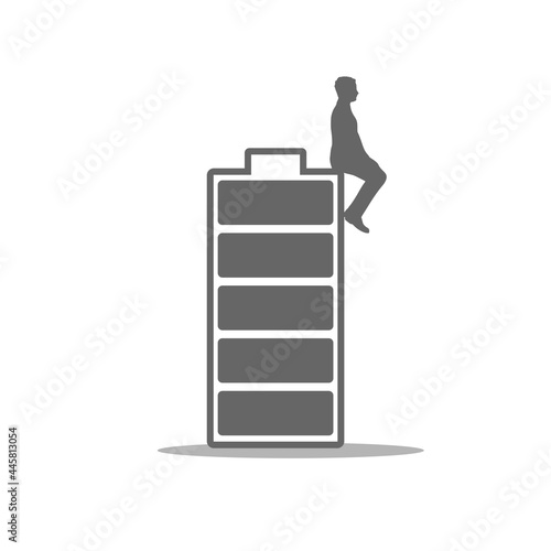 Businessman sitting on high full level energy battery photo