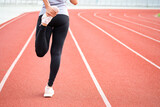 Fitness women She stretched the leg muscles. Prepare to run in the running track