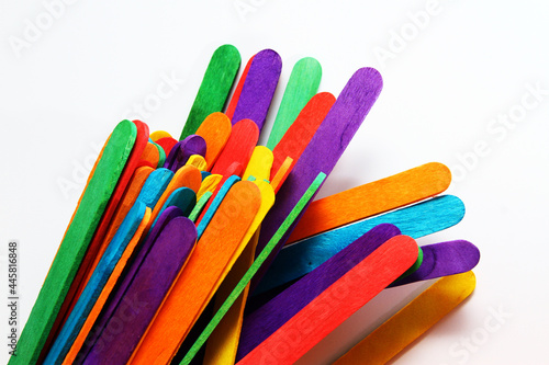 Colorful wooden craft sticks on white background