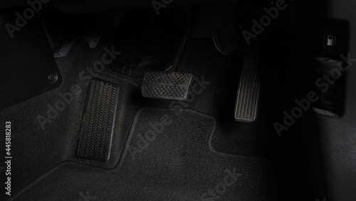 Canvastavla Man foot and accelerator and brake pedal inside the car or vehicle and copy space which black color leather shoe stepped on it for speed up or control automobile pace power