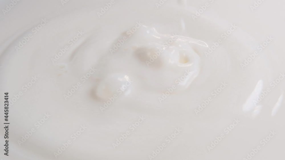 Milk drops close-up. Slow motion.Fresh organic farm milk. Milk texture. Milk surface and milk drops close-up Milk drops close-up. Slow motion.Fresh organic farm milk. Milk texture. Milk surface and milk drops close-up