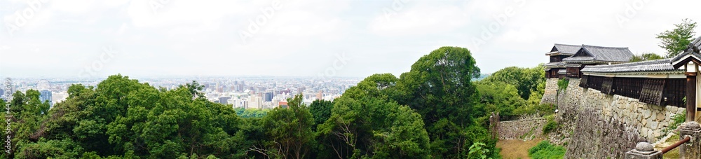 Panoramic view of Matsuyama city from Matsuyama castle in Ehime, Japan - 日本 愛媛県 松山市 街並み Panoramic view of Matsuyama city from Matsuyama castle in Ehime, Japan - 日本 愛媛県 松山市 街並み