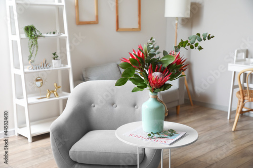 Table with protea flowers a...