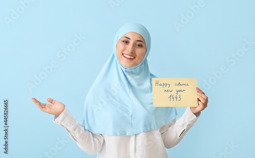 Young Muslim woman with gre...