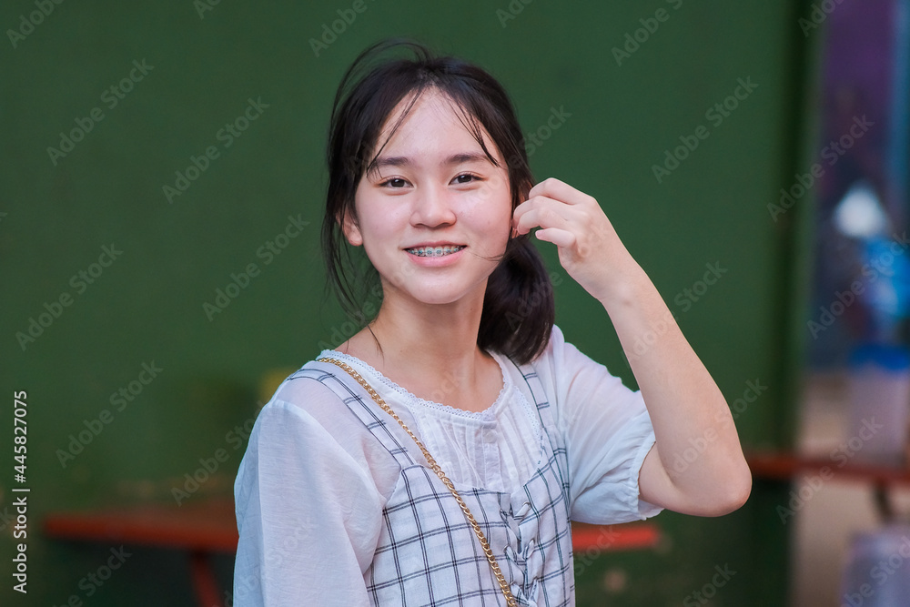 Portrait of teenager girl happy walking on city streets, Portrait of teenager girl happy walking on city streets,