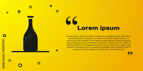 Black Bottle of wine icon isolated on yellow background. Vector