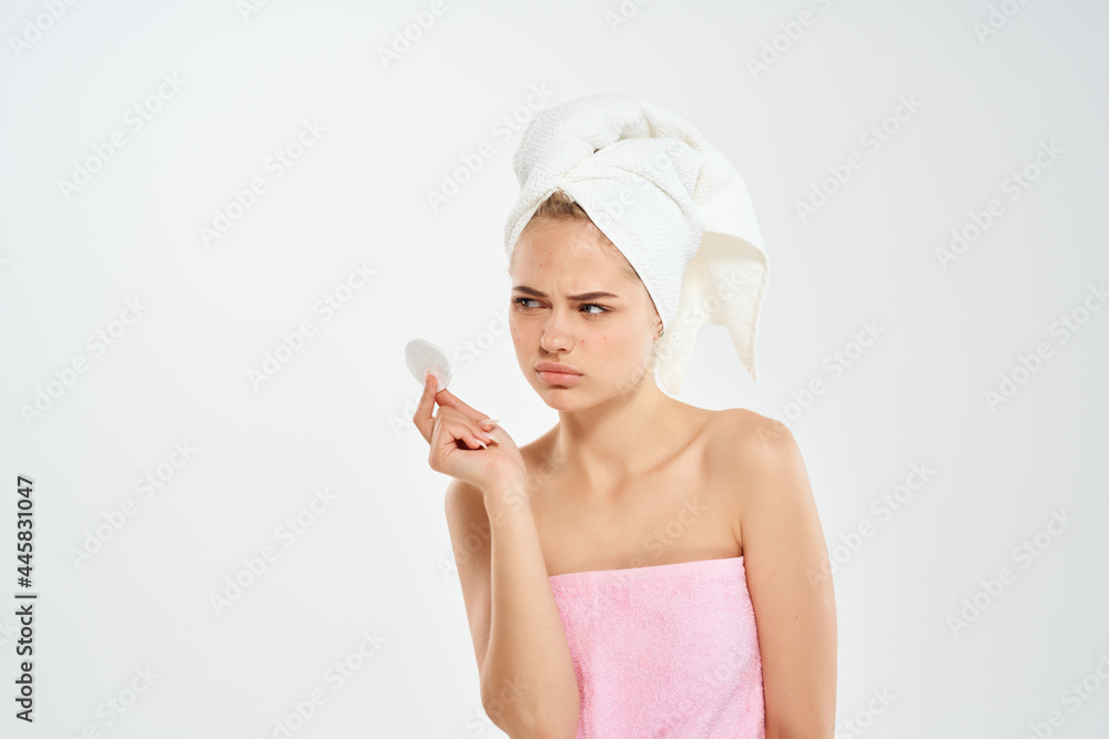 woman with a towel on her head cotton pads health hygiene close-up woman with a towel on her head cotton pads health hygiene close-up