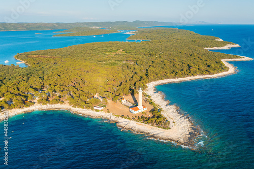 Fototapeta Naklejka Na Ścianę i Meble -  Aerial view of the lighxthouse Veli Rat on Dugi Otok island, the Adriatic Sea in Croatia