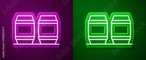 Glowing neon line Wooden barrel for wine icon isolated on purple and green background. Vector