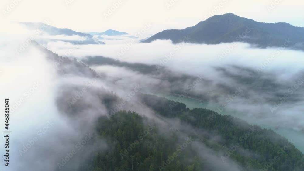 Altay, aerial shot - morning fog in the moutntains Altay, aerial shot - morning fog in the moutntains