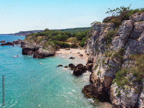 An exotic beach with crystal clear water, fine yellow sand and blue sea waves. 