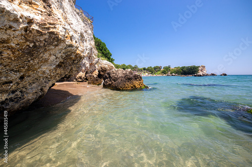 An exotic beach with crystal clear water, fine yellow sand and blue sea waves. 