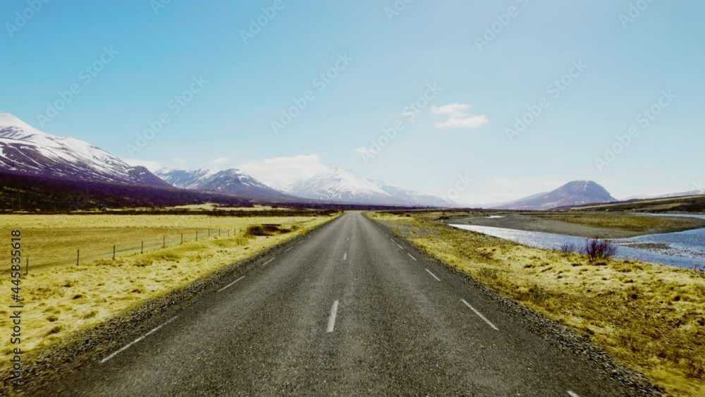 Endless Horizon of the Road Surrounded by Mountain Ranges Under a Blue Sky Endless Horizon of the Road Surrounded by Mountain Ranges Under a Blue Sky