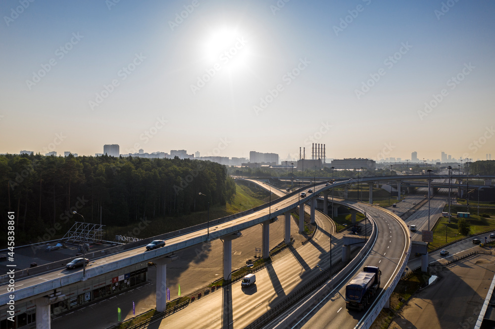 panoramic view of the motorway junction and fast moving cars filmed from a drone 