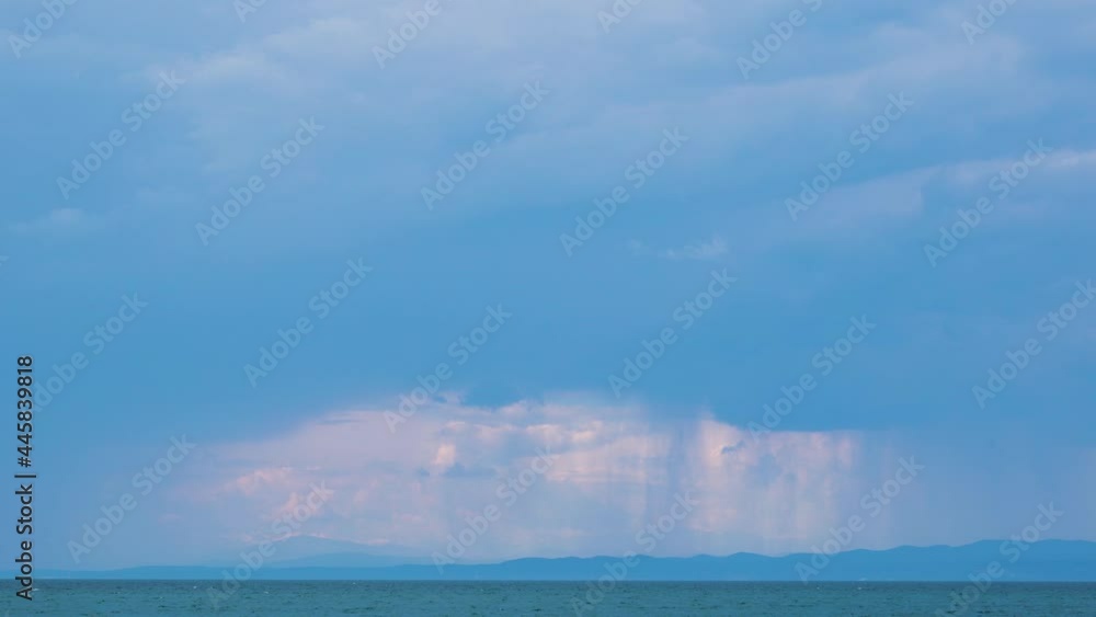 Italian coast and summer storm in the distance. Storm clouds moving over Adriatic Sea. Real time, static shot Italian coast and summer storm in the distance. Storm clouds moving over Adriatic Sea. Real time, static shot