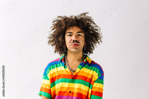 Gay man posing in a studio during pride month photo