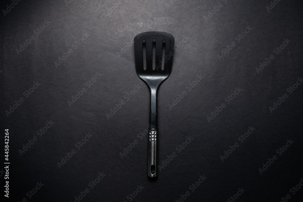 Studio picture of black plastic spatula with chromed handle. Studio picture of black plastic spatula with chromed handle.