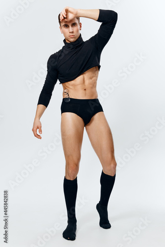man in full growth, inflated torso bodybuilder fitness underpants and black sweater  © SHOTPRIME STUDIO
