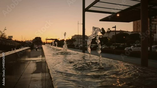 Water feature at sunset filmed in slow motion on San Pedro de Alcántara Boulevard in Marbella Southern Spain