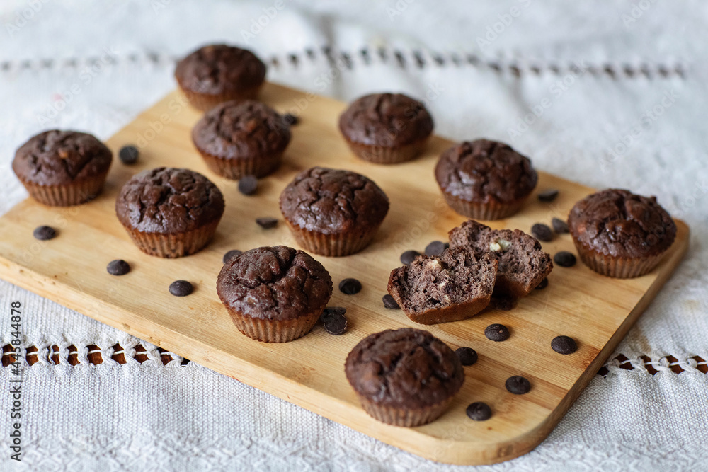 Homemade chocolate muffins on a wooden table
