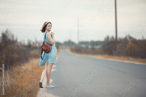 Young girl on a walk in the autumn