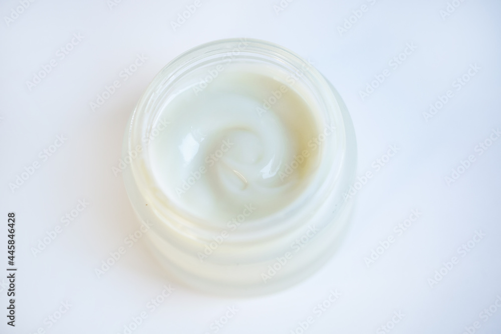 Cream in a jar on a white background Cream in a jar on a white background