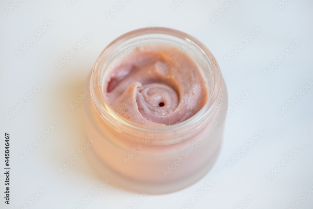 Cream in a jar on a white background Cream in a jar on a white background