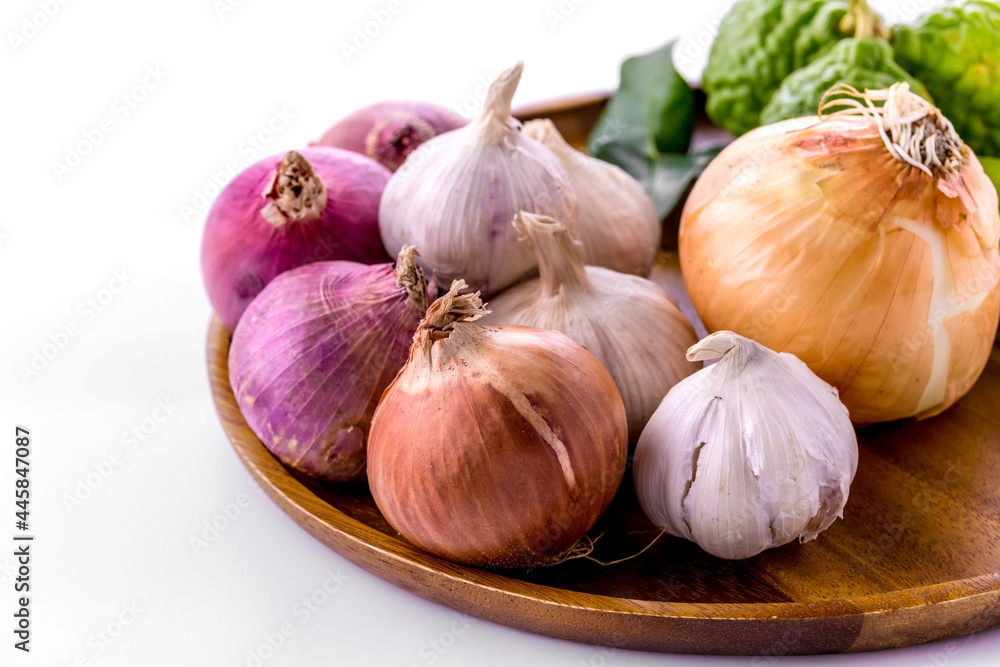 Obraz premium Bergamot onion and garlic on white background