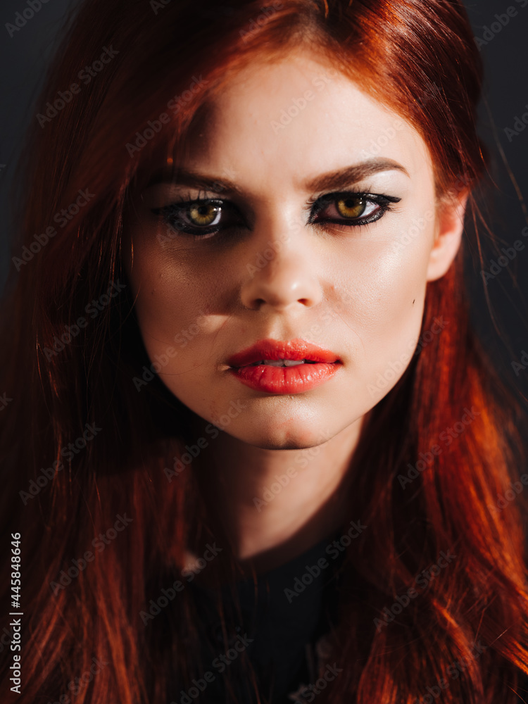 Fototapeta premium pretty woman bright makeup smoke from mouth studio
