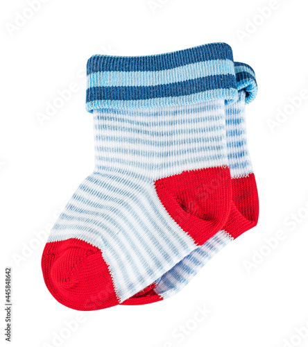 Children's  tiny striped socks, white, blue and red in the pattern. Isolated on a white background.