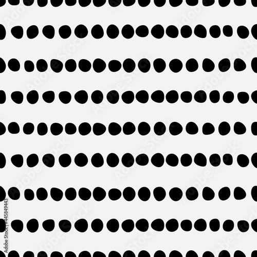 Seamless dots. Vector black repeated dots pattern or wallpaper.
