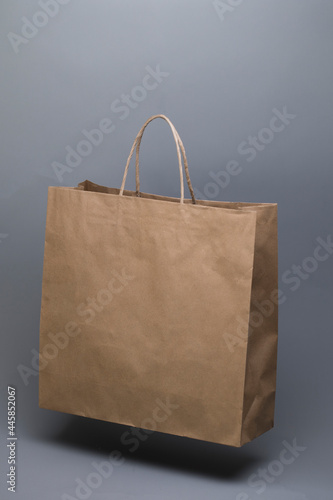 Paper shopping bag on dark background