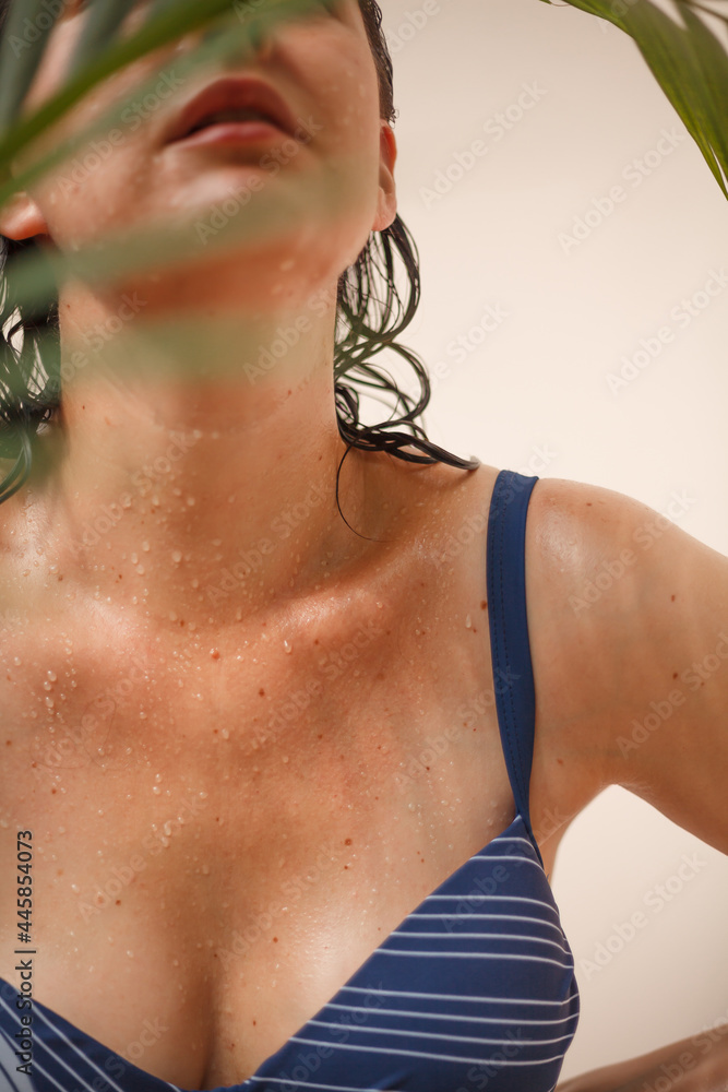 Water drops on body of woman in swimsuit Water drops on body of woman in swimsuit