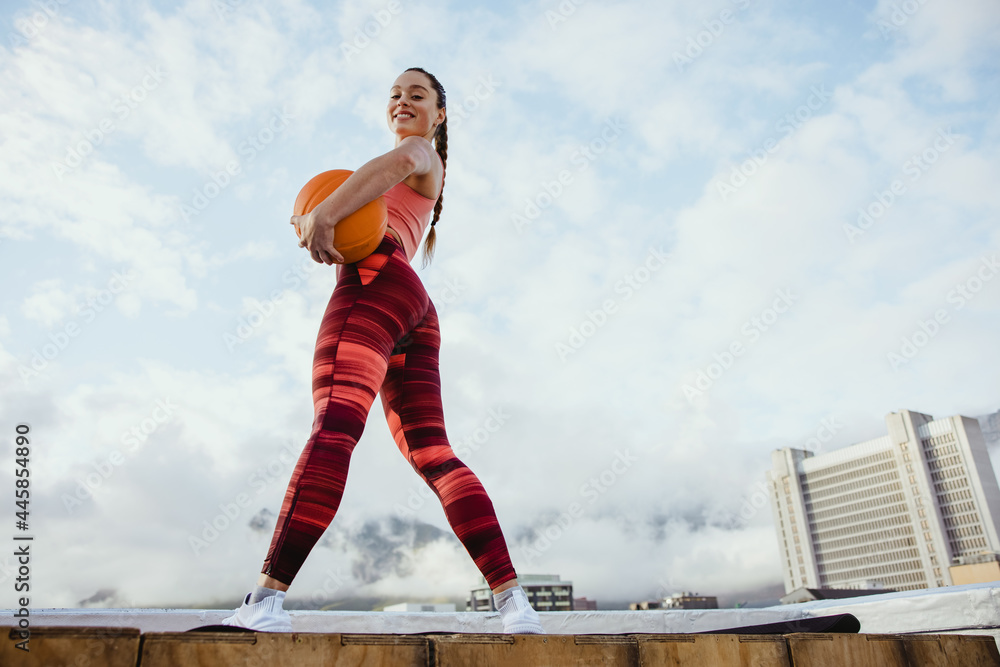 Fitness woman with basketball