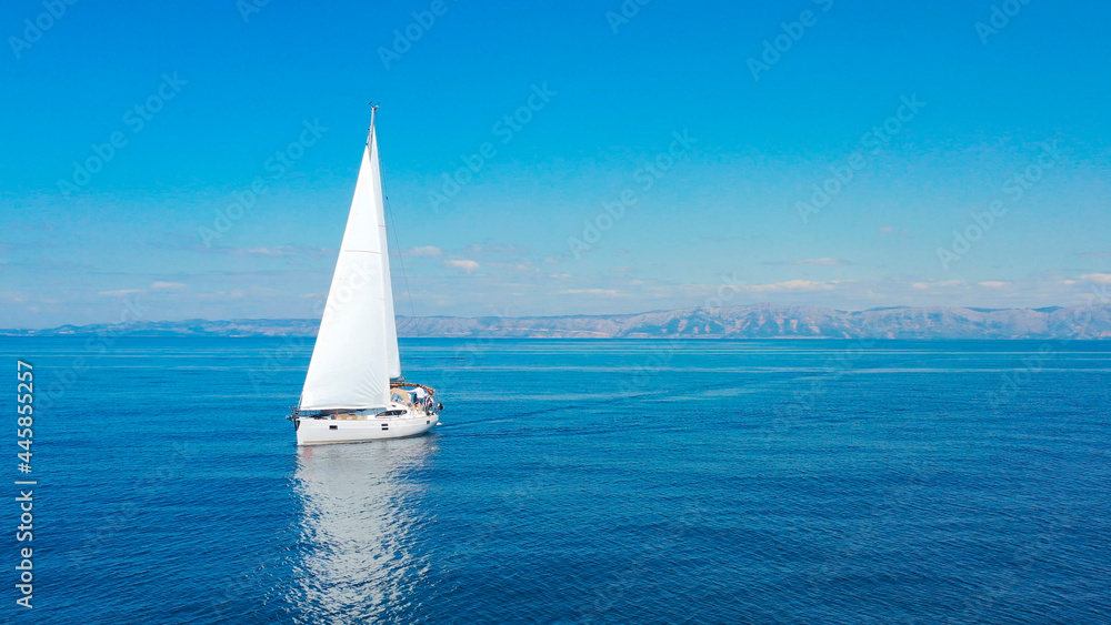 Obraz premium Aerial view of sailing luxury yacht at opened sea at sunny day in Croatia