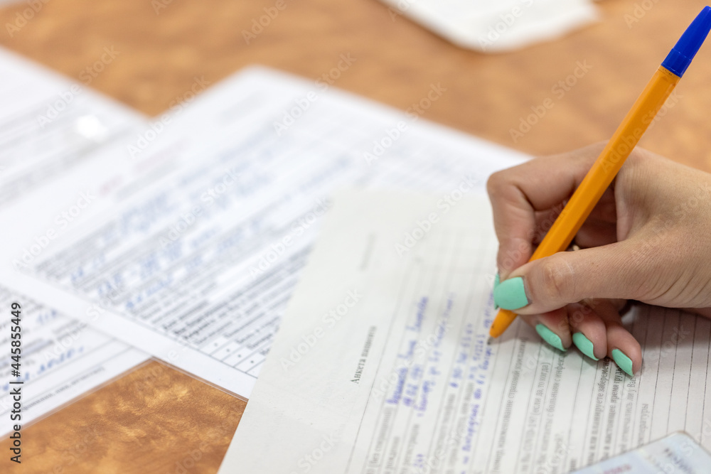 Obraz premium Questionnaire Application Form Vaccination Medical Clinic Hand Write Pen Tick Paper Document Sample Fill Table Closeup Contract Office Survey Business Education Voting Taking Decision Deal