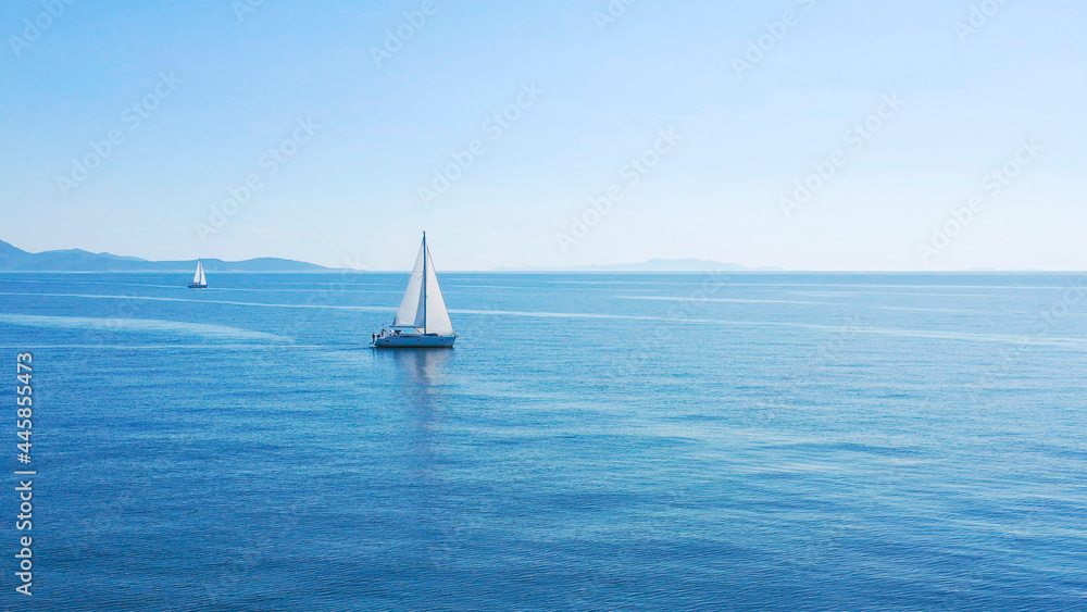 Fototapeta premium Aerial view of sailing luxury yacht at opened sea at sunny day in Croatia